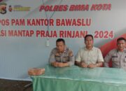 Personel OMP Rinjani 2024 Polres Bima Kota Laksanakan Pengamanan 24 Jam di Kantor KPU dan Bawaslu Kota Bima